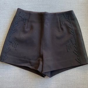 Black H&M shorts with details on sides in size 4.